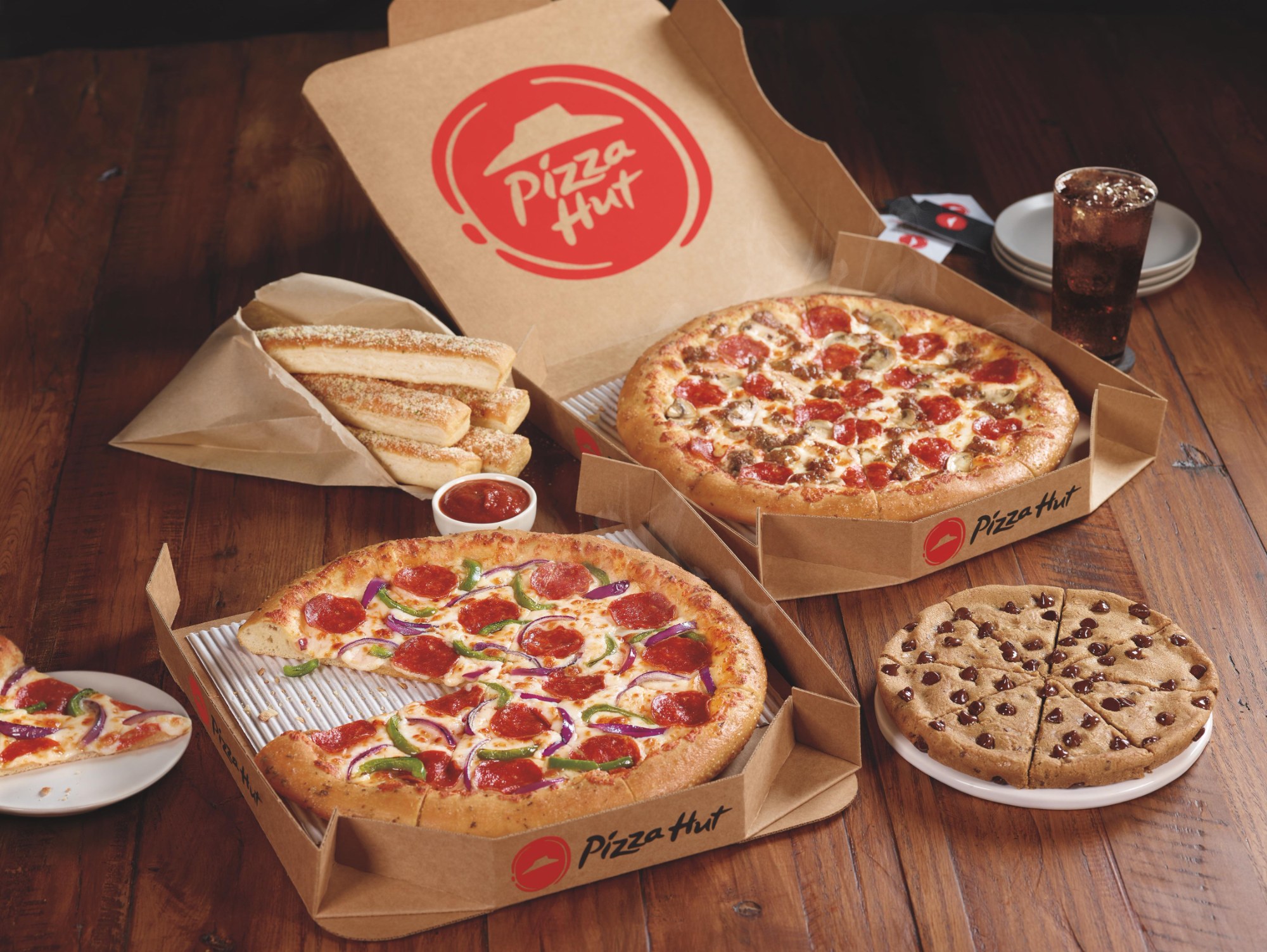YUM SELLS PIZZA HUT FOR $2.7Bn, SPLITS BRAND